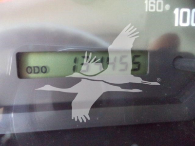 Isuzu NPR HD instrument cluster showing odometer display.
