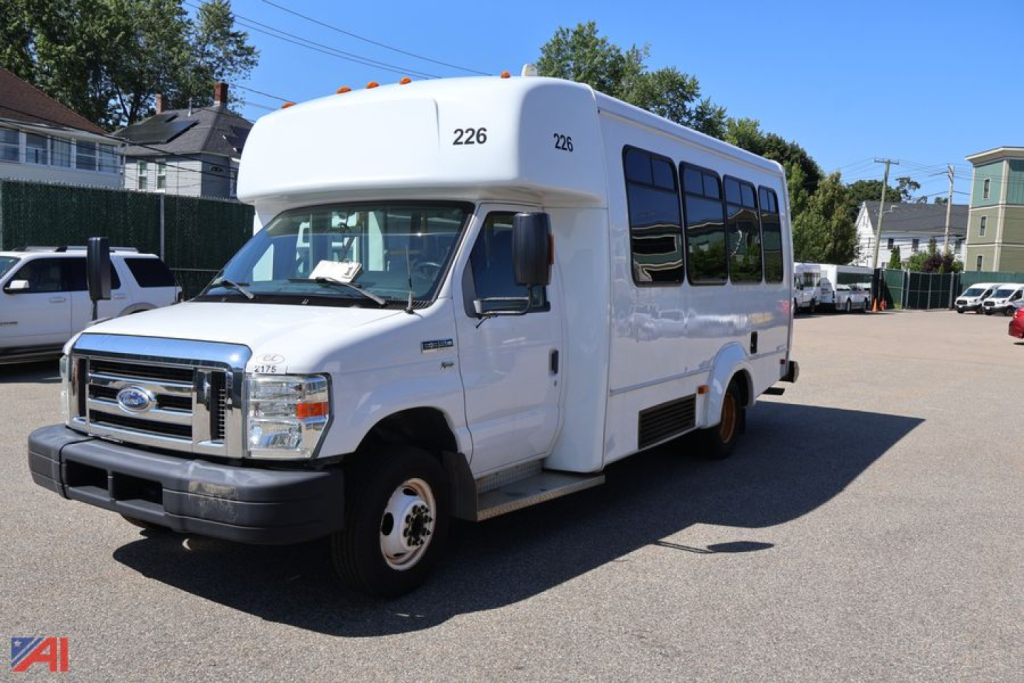 Ford E-350 behind view showing front and driver's side of wheelchair bus with number 226 on top front.