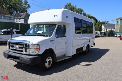 Ford E-350 behind view showing front and driver's side of wheelchair bus with number 226 on top front.