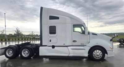 Kenworth T680 tractor side view with cab and dual rear axles.