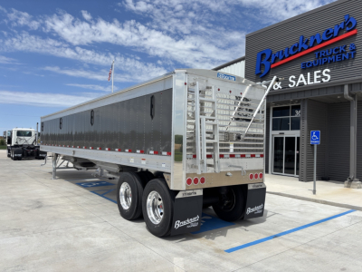 40' aluminum grain hopper trailer with 68" sides, dual rear axles, shown at a sales lot with Brucket's signage in background.
