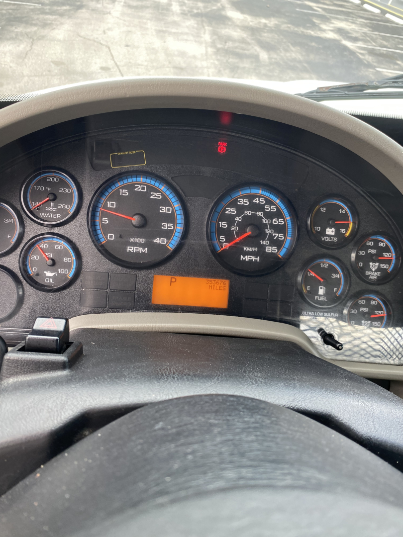 Dashboard of a 2018 International 4300 truck showing multiple gauges including RPM, MPH, and warning lights; orange P indicator visible.