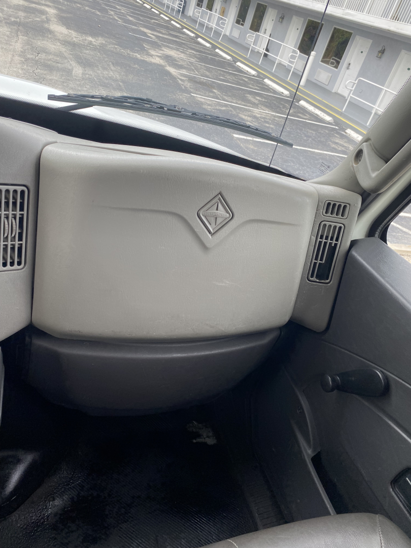 Dashboard of a 2018 International 4300 truck showing the center dash with a diamond logo and surrounding vents.