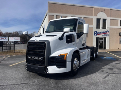 Mack PR64T truck in white, front-left view showing grille, headlight, and side mirror with stock number 71416 visible.