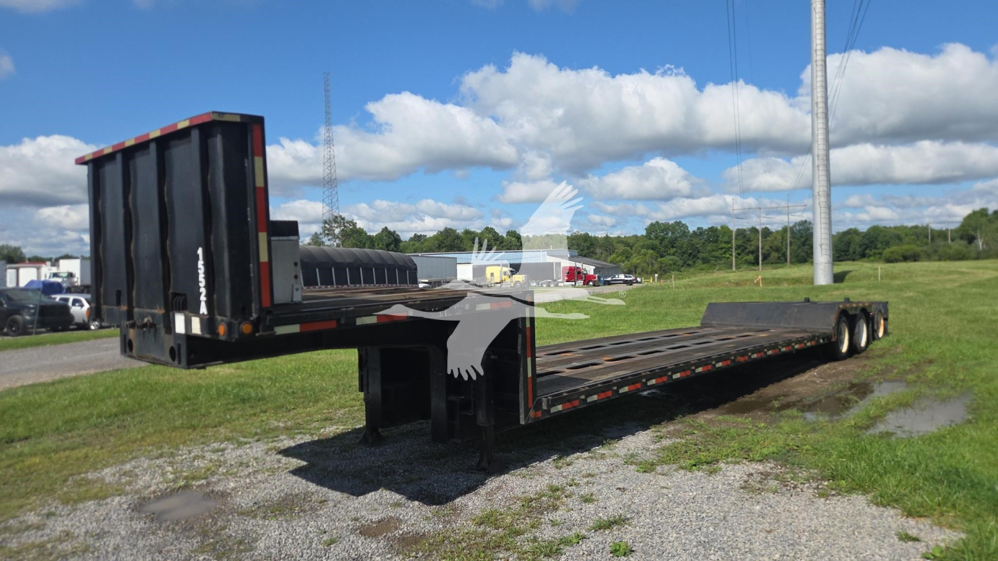 Trailer king lowboy with extended flatbed and dropped gooseneck showing brand and dual rear axles.