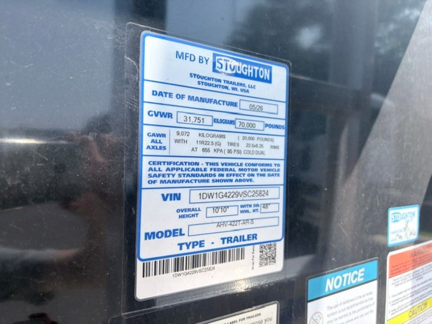 Stoughton hopper trailer data plate showing MFD BY ST/www brand label, GVWR 31,751 lb, 70,000 lb? gross vehicle weight, VIN 1DW1G4229VSC25824, model and trailer information.