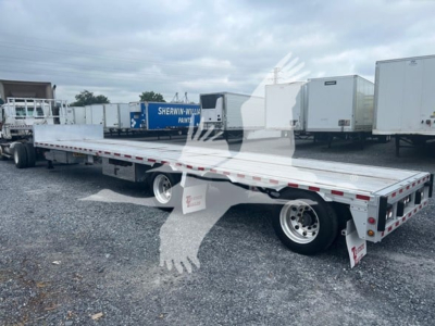 Drop deck trailer showing 2019 Reitnouer Dropmiser with aluminum flatbed and tandem axles, used condition, VIN 1RND48A2XKR045057.