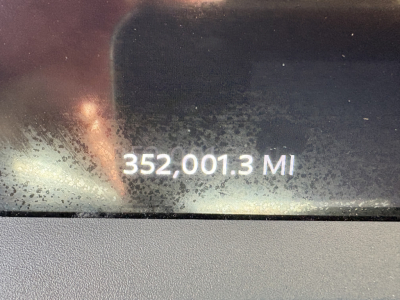 Vehicle odometer display reading 352,001.3 miles in Peterbilt cab interior.