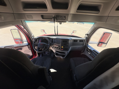  Peterbilt truck cab interior dashboard and steering wheel view from passenger seat.