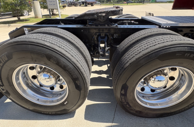 Peterbilt 579 rear dual axle truck chassis with dual rear wheels and chrome rims, visible tires and undercarriage framing.