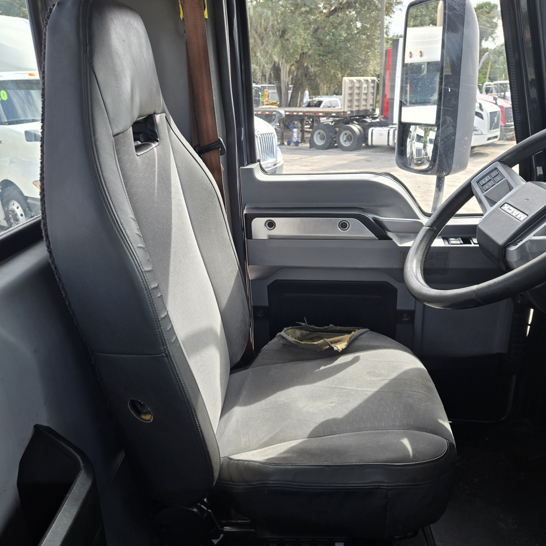 Cab interior of a 2019 Mack ANTHEN day cab truck showing driver seat, steering wheel, and dashboard with minimal wear.