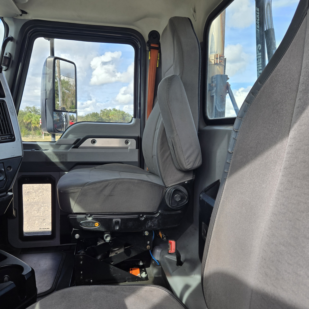 Cab interior of a 2019 Mack ANTHEM day cab truck showing driver seat and surrounding controls.