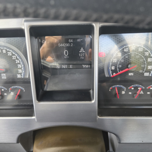 Dashboard view of a 2019 Mack ANTHEN day cab truck showing digital gauge cluster with speed 0 MPH, gear selector N I L E, and surrounding analog gauges.