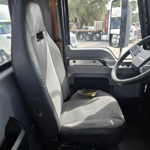 Cab interior of a 2019 Mack ANTHEN day cab truck showing driver seat, steering wheel, and dashboard with minimal wear.