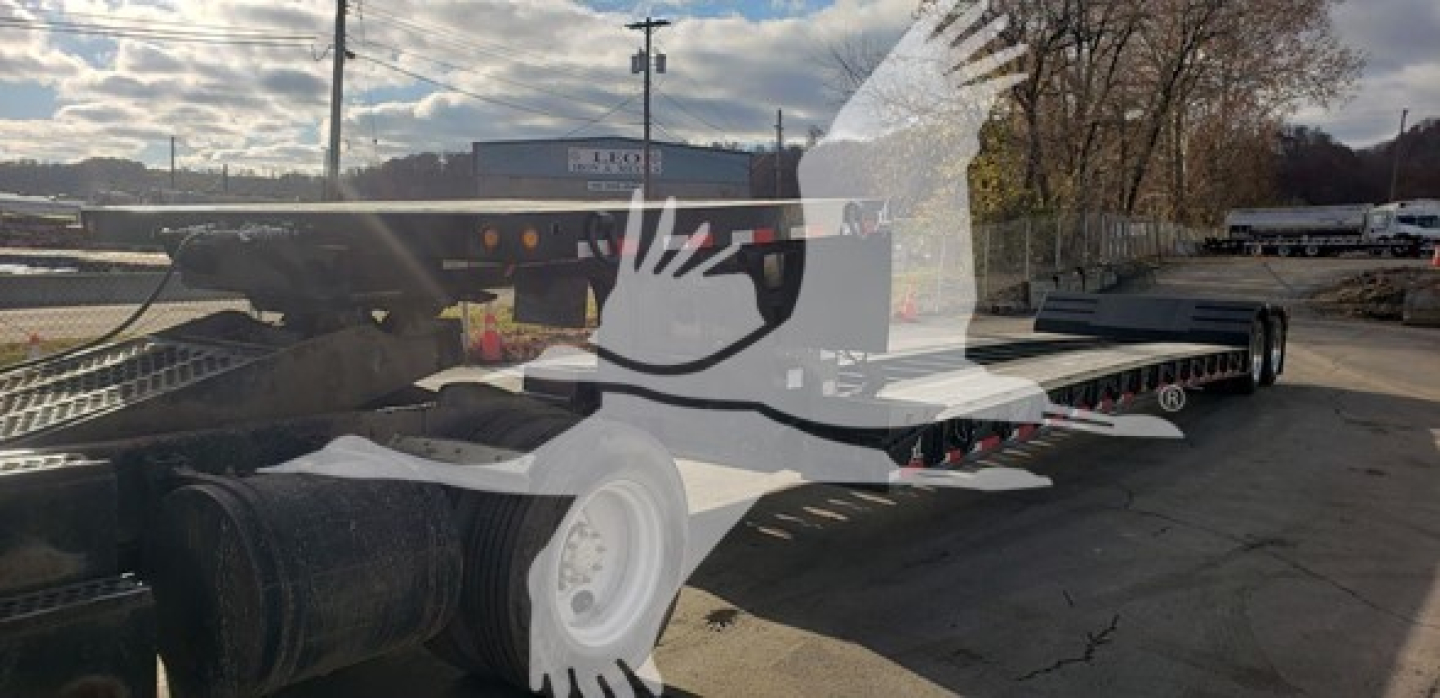 Lowboy trailer showing a flatbed car carrier with dual axles and a long deck. Visible text on stickers: VIN 4U3J04929LL019364, stock number 48-6048, trailer category lowboy.
