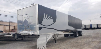 Curtainside trailer showing Benson aluminum flatbed with graphic artwork on sides and rear doors, dual rear axles.