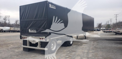 Alum flatbed trailer with curtainside configuration showing Benson logo and rear doors.