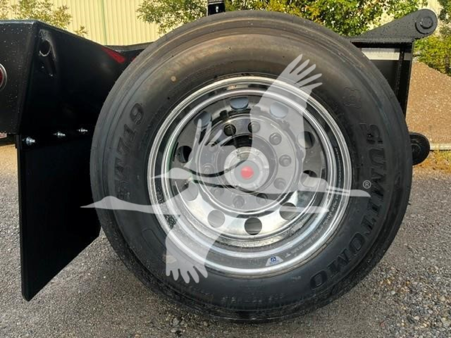 Fontaine flip axle trailer wheel with tire and chrome rim, side view showing hub and lug nuts