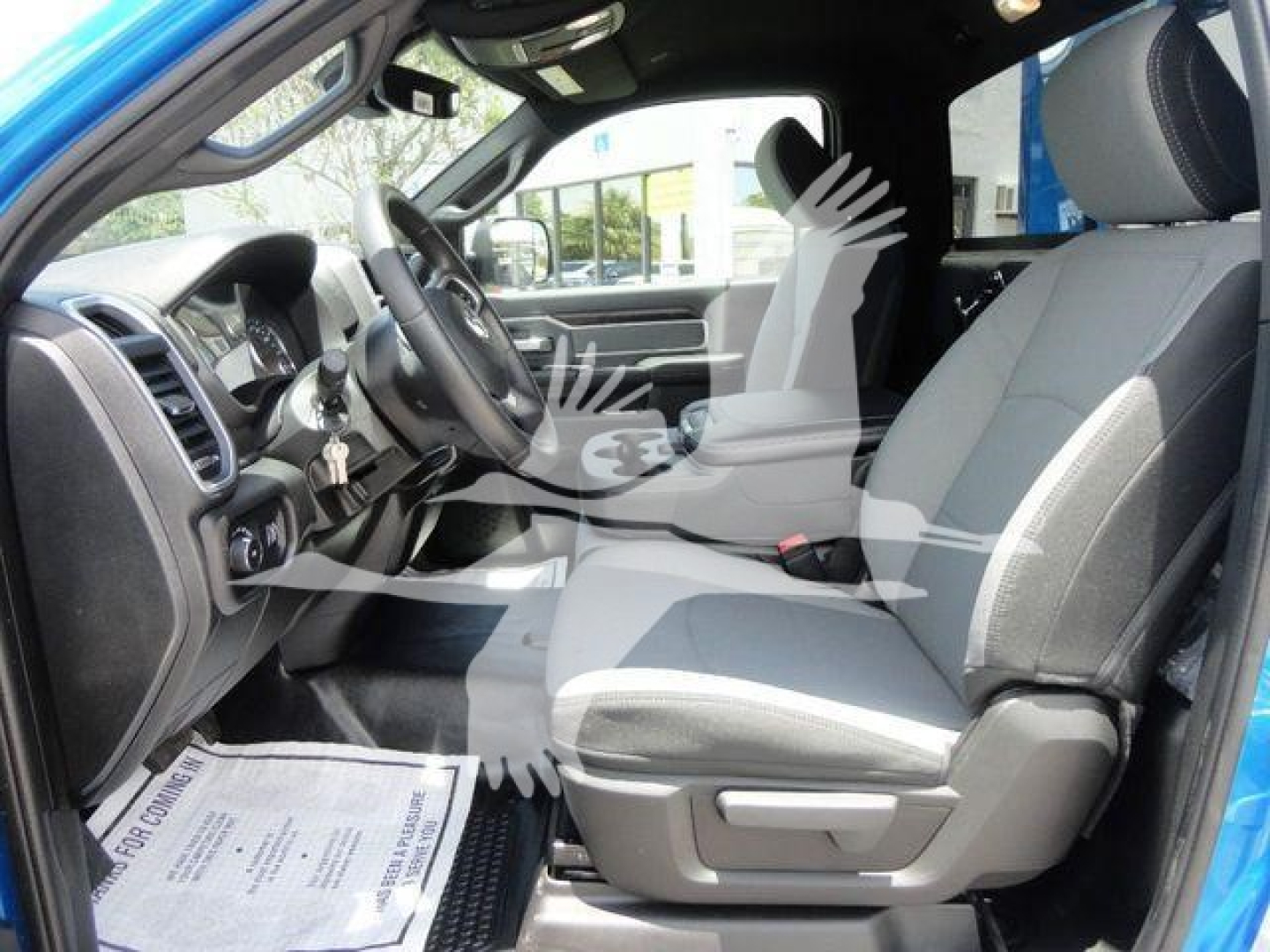 Ram 4500 SLT interior showing front seats and steering wheel with gray cloth upholstery and dashboard view.