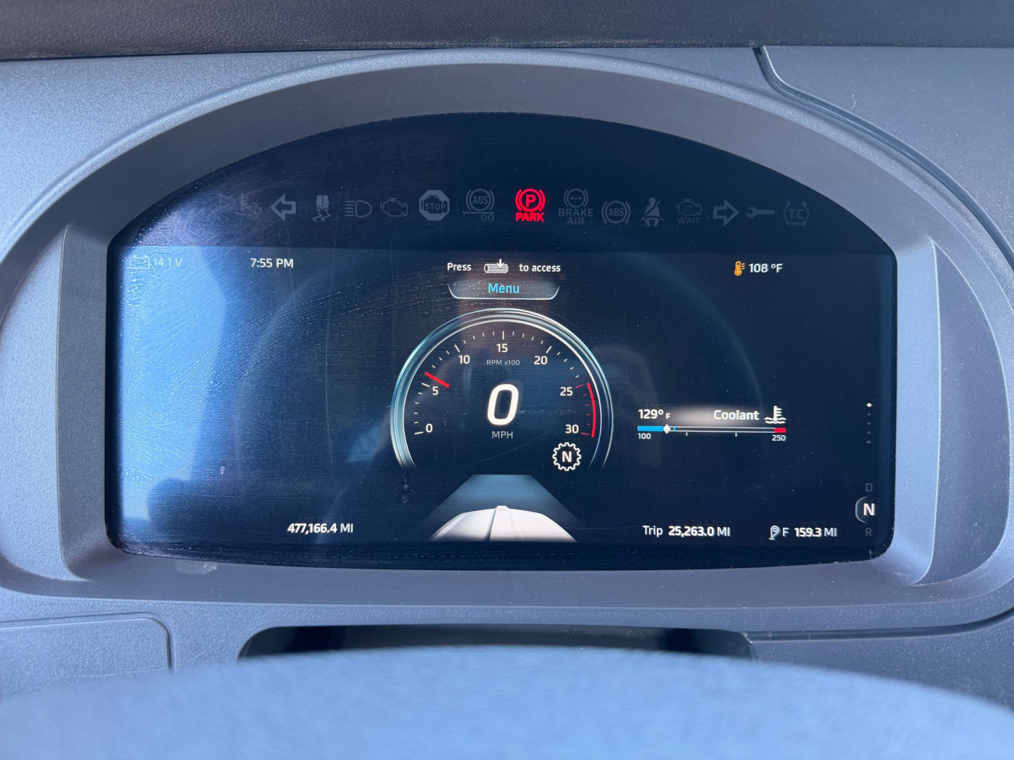Dashboard display of a 2024 Kenworth T680 showing digital gauge at zero mph, coolant gauge, and trip miles; VIN and stock info not visible on the dashboard.