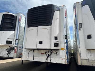 Utility reefer trailer with Powercooler front doors and Carrier refrigeration unit, 2018 model in-service. Front view shows vents and control panel area.