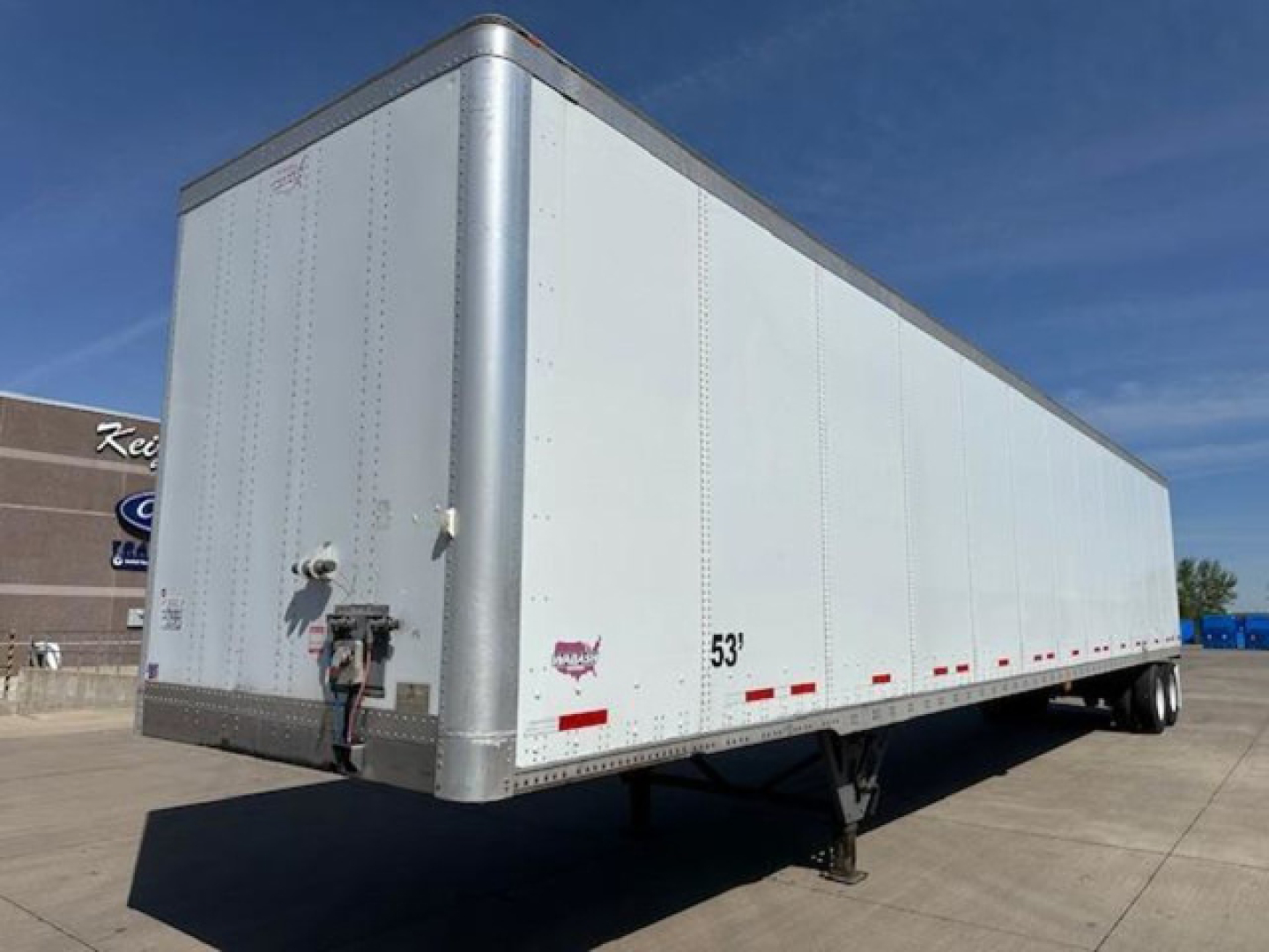 Trailer side view of a 53' aluminum Wabash van trailer with kei axles and rear doors, stock number U90828, VIN 1JJV532D0GL908621.