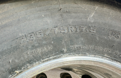 Tire sidewall with markings: 265/75R17.5 and other small text; close-up of wheel and rim.