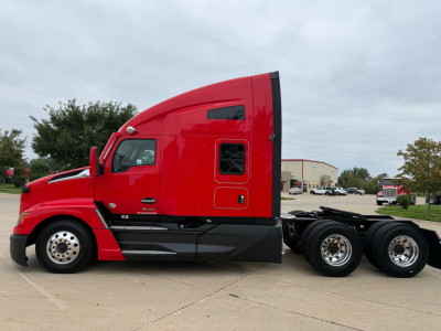 Kenworth T680 truck side view showing sleeper cab and attached chassis with red paint and black lower trim.