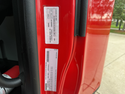 Kenworth T680 door jamb with VIN sticker and stock number label visible