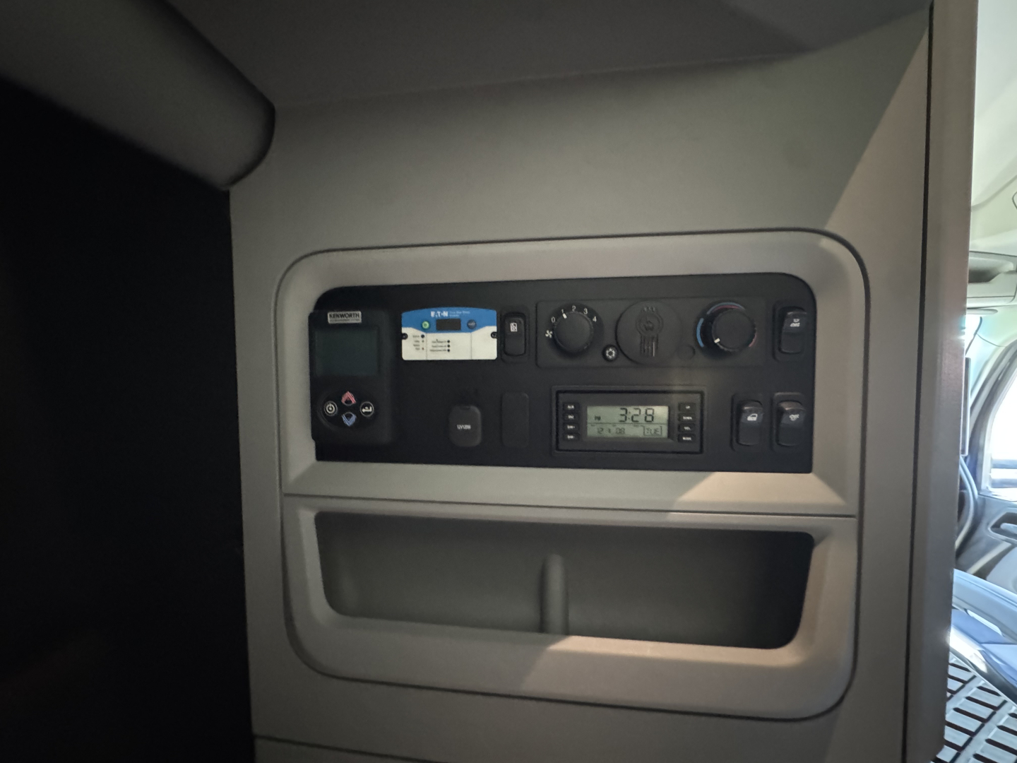 Kenworth T680 interior dash panel showing gauges and control cluster.