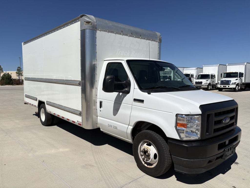 Ford E-350 box truck with white cab and aluminum box, front-right view.
