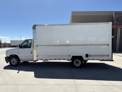 Ford E-Series box truck side view showing large cargo box and cab, no visible branding, white exterior, medium wheelbase.