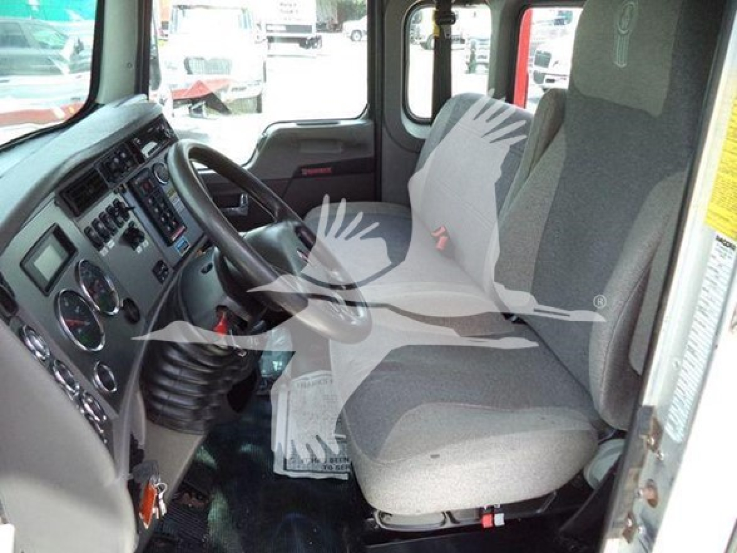 Kenworth T270 truck cab interior showing driver seat and dashboard with steering wheel and instrument cluster.