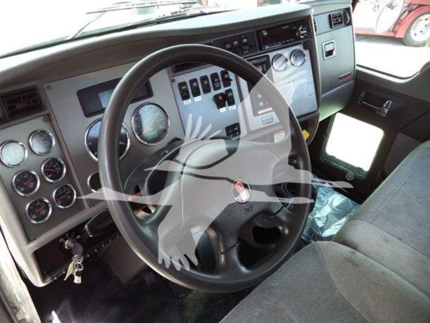 Kenworth T270 truck interior showing steering wheel and dashboard gauges and controls.