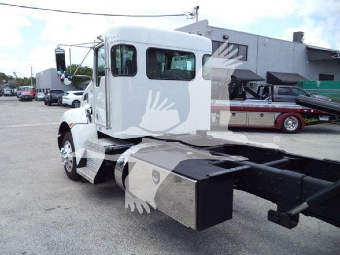 Kenworth T270 roll-back truck cab and chassis with visible side window and rear hook-up area. Text not legible beyond VIN and stock number not on image.