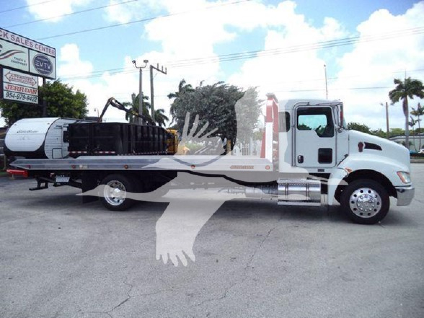 Kenworth T270 rollback tow truck in service showing flatbed with crane and a Z-rear winch.