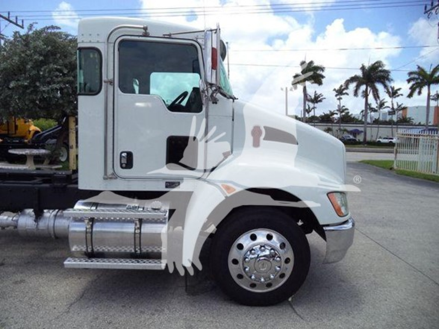 Kenworth T270 regular cab side view showing front wheel and chrome fuel tank with side steps.