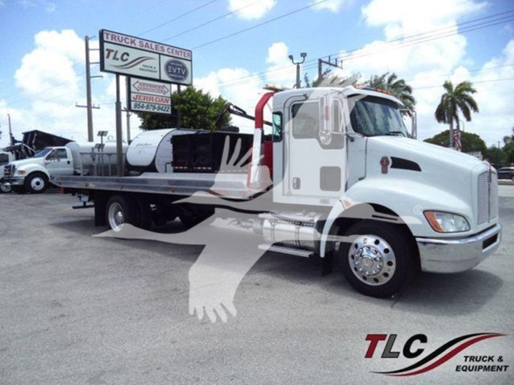Kenworth T270 rollback truck in light gray with a flatbed, side view showing the cab and front wheel.