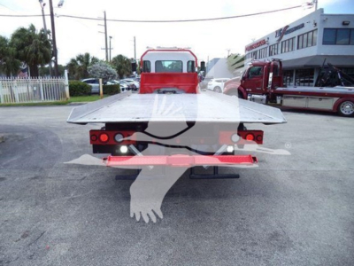 Kenworth T270 rollback truck rear view showing flatbed and taillights.