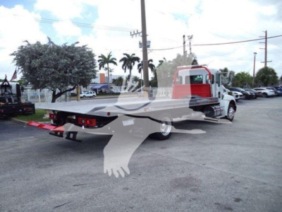 Kenworth T270 rollback truck viewed from rear quarter showing flatbed and tow equipment.
