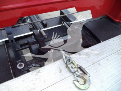 Kenworth T270 rollback truck rear setup showing hydraulic/tie-down hardware and winch hook on aluminum ramp surface.