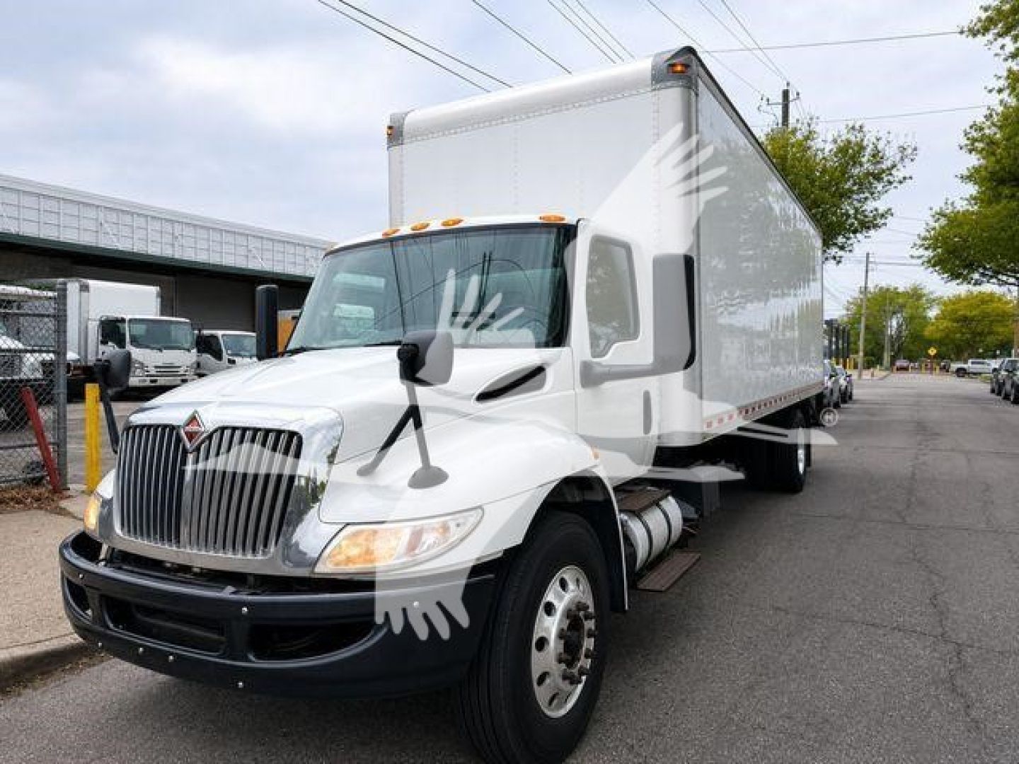 Image of 2020 International MV box truck showing front and right side with cab and cargo box