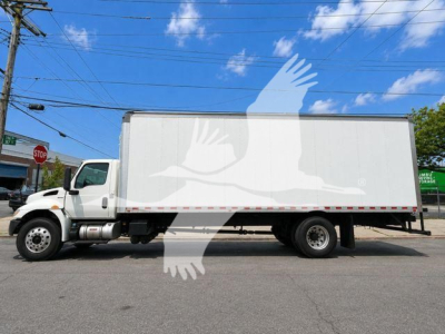 Truck side view showing a white box truck with cab, GVW and stock details not visible on image.