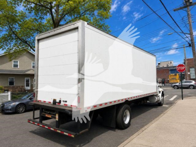 Truck box rear view on a 2020 International MV, side view, stock number T06081 P, box body with white panels and dual rear wheels.