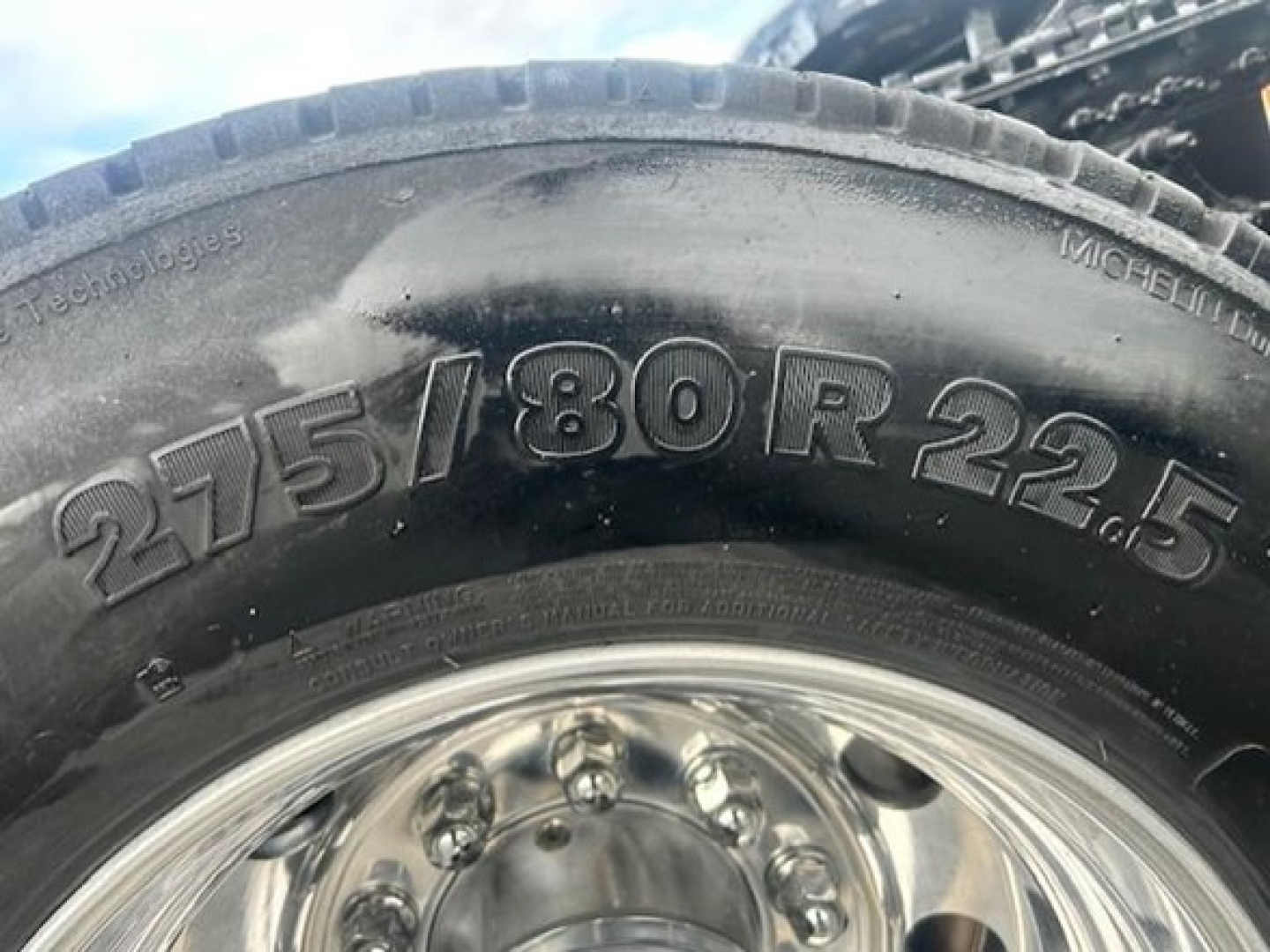 Tire sidewall showing tire size 275/80R22.5 on a Freightliner Cascadia truck wheel.