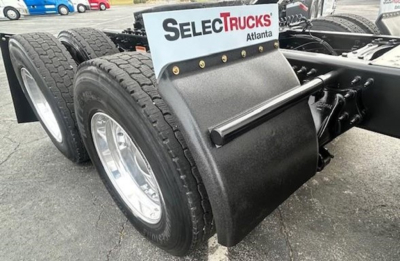Freightliner Cascadia 126 rear chassis showing dual rear wheels and fender mudguard with SelecTrucks Atlanta plate.