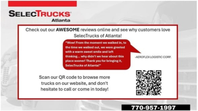 Freightliner Cascadia 126 truck image showing SelectTrucks Atlanta banner, QR code, and showroom dealership contact details.
