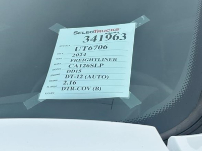 Truck window sticker visible with listing number 341963, VIN UT67006, year 2024, Freightliner Cascadia 126, DD15 engine, DT-12 (AUTO) transmission, DTR-COV (B) option.