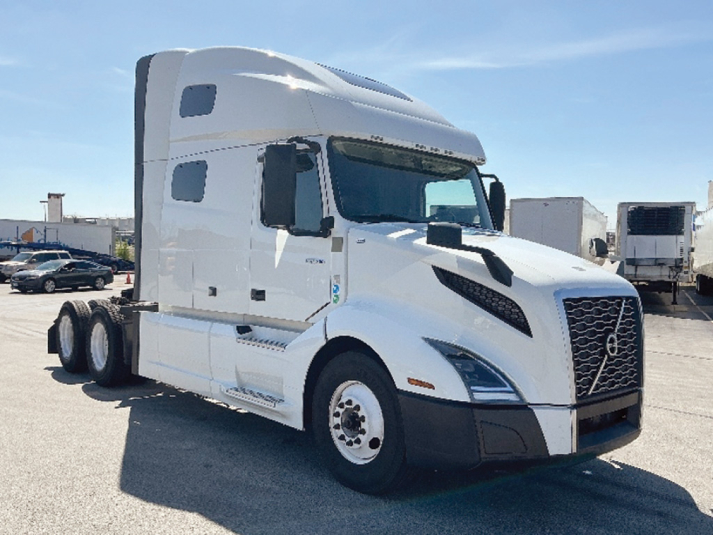 Volvo VNL 760 truck cab in white with sleeper, front grille and headlights visible.