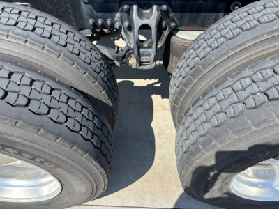 Kenworth T680 rear axle assembly and dual tires viewed from beneath, label text not visible.